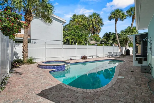 a view of a backyard with swimming pool