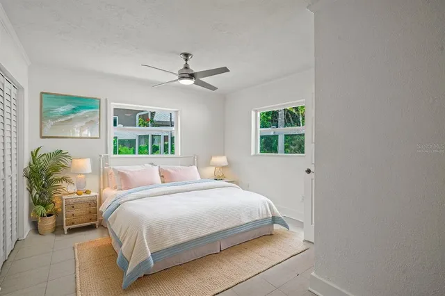 a view of room with window and ceiling fan