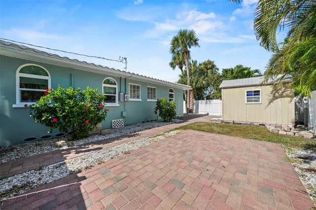 a house view with a backyard space