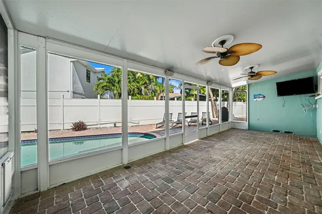 a view of a room with lots of wooden furniture