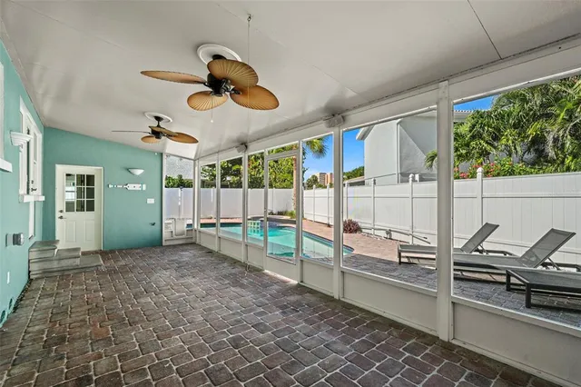 a view of a backyard with plants and swimming pool