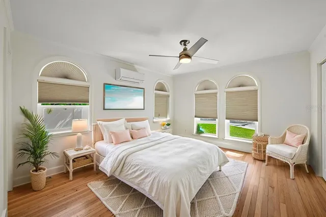 a bed room with a bed and a chair