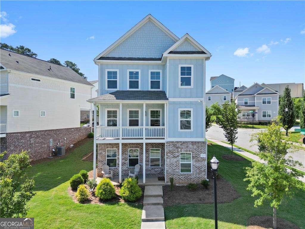 a front view of a house with a yard