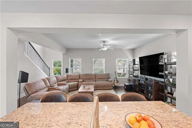 a living room with furniture and a flat screen tv