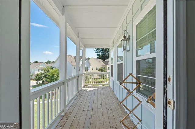 a view of a balcony with wooden floor