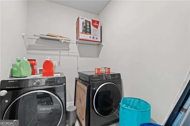 a bedroom with a bed table and a window