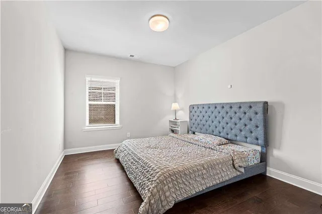 a bathroom with a sink a mirror a toilet and a mirror