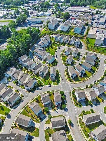 an aerial view of residential houses with outdoor space