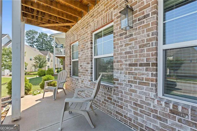 a view of a chair and table in the balcony