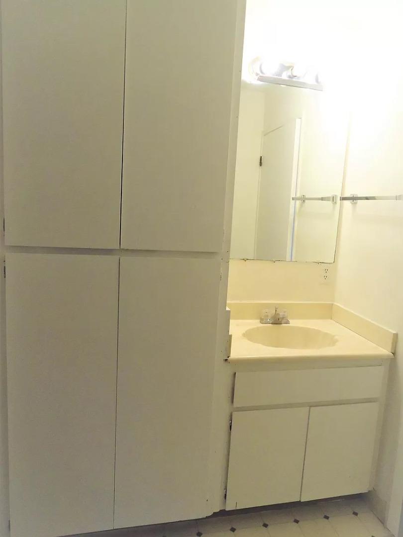 195 East Reed Street, Unit 4 San Jose, CA 95112 - Photo 8 of 11 a bathroom with a sink and a mirror