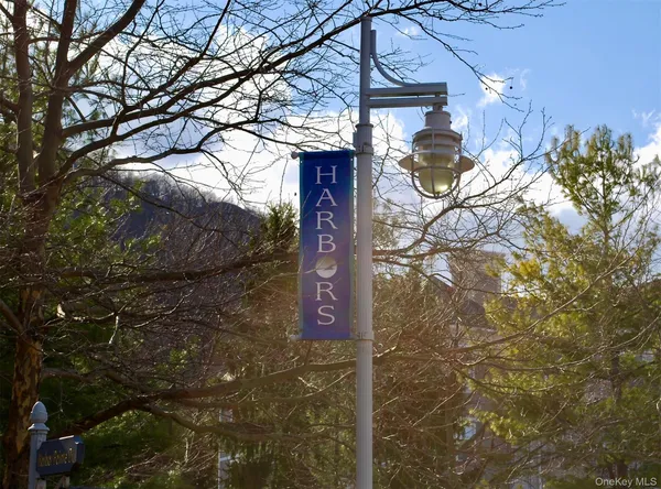a view of a terrace with wooden floor and lake view