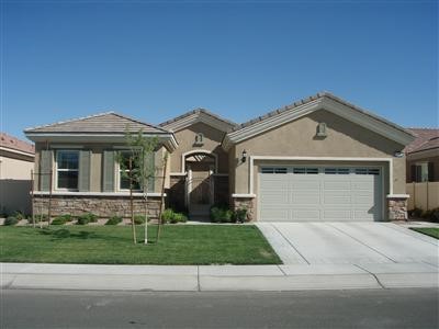 10093 Redstone Road Apple Valley, CA 92308 - Photo 1 of 1 a front view of a house with a yard and garage
