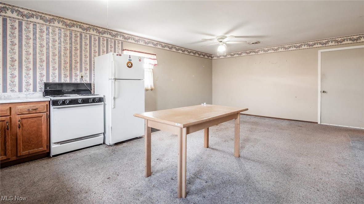 1950 Newark Road Zanesville, OH 43701 - Photo 35 of 39 Kitchen with white appliances and ceiling fan