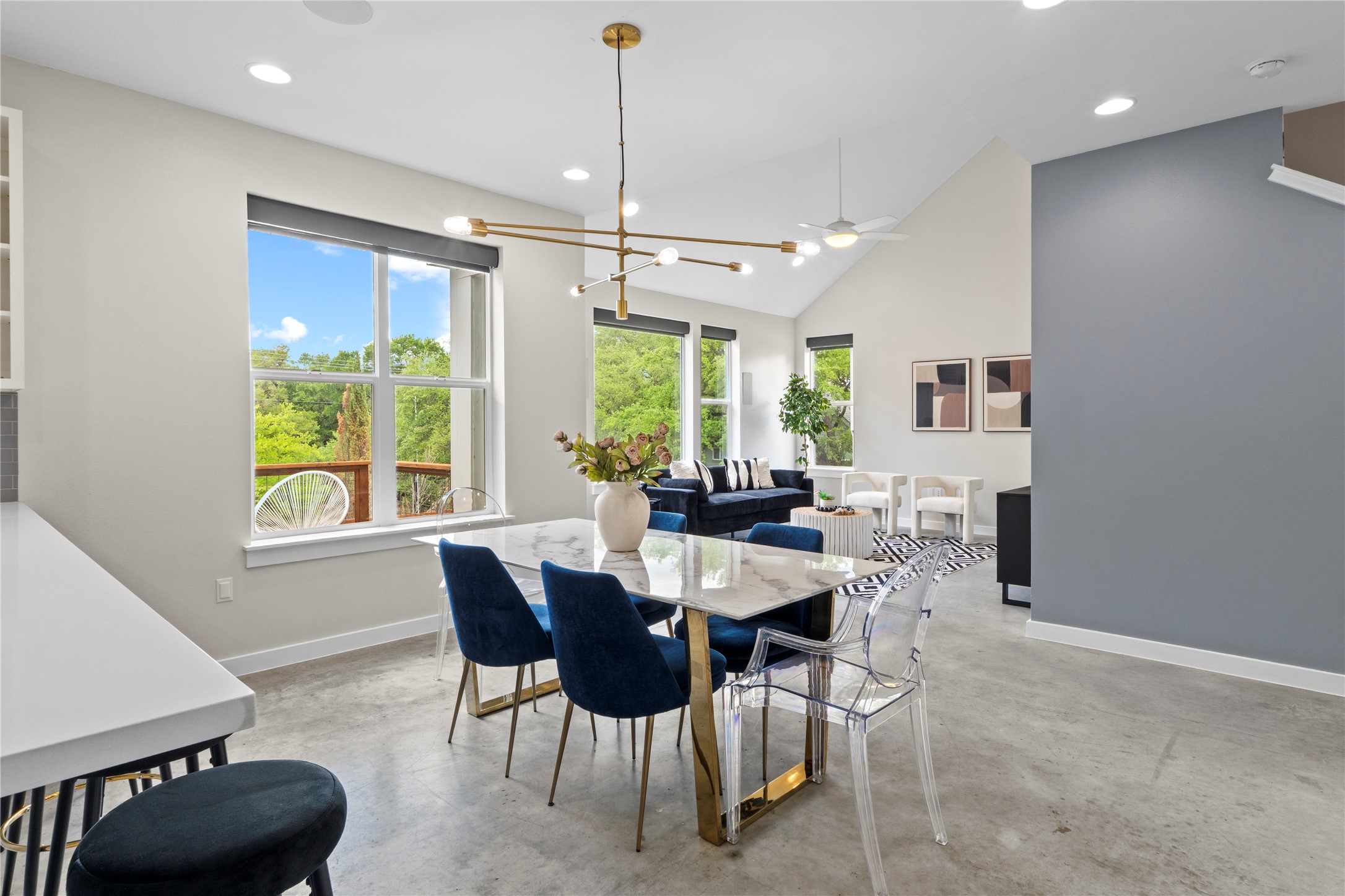 3001 Del Curto Road, Unit 35 Austin, TX 78704 - Photo 8 of 22 The living area features high vaulted ceilings, recessed lighting, and large windows providing abundant natural light and views of the surrounding greenery