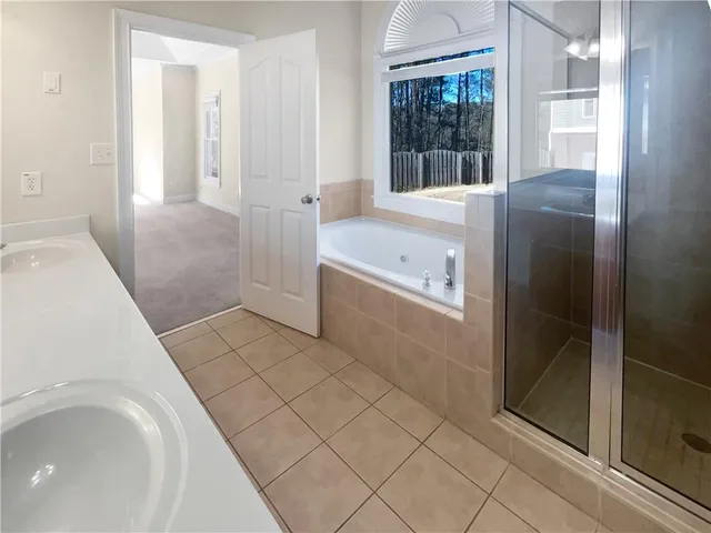 a bathroom with a bathtub and a sink
