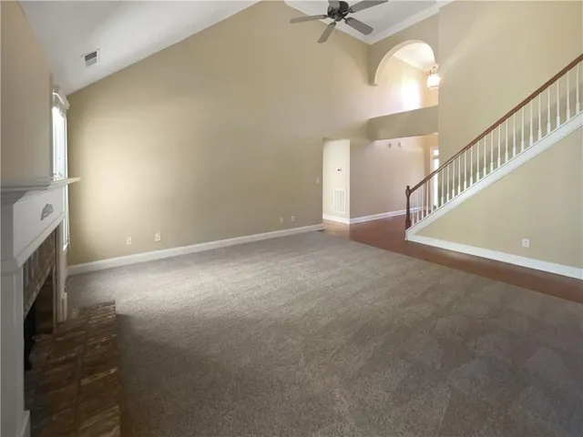 a view of an empty room with a fireplace