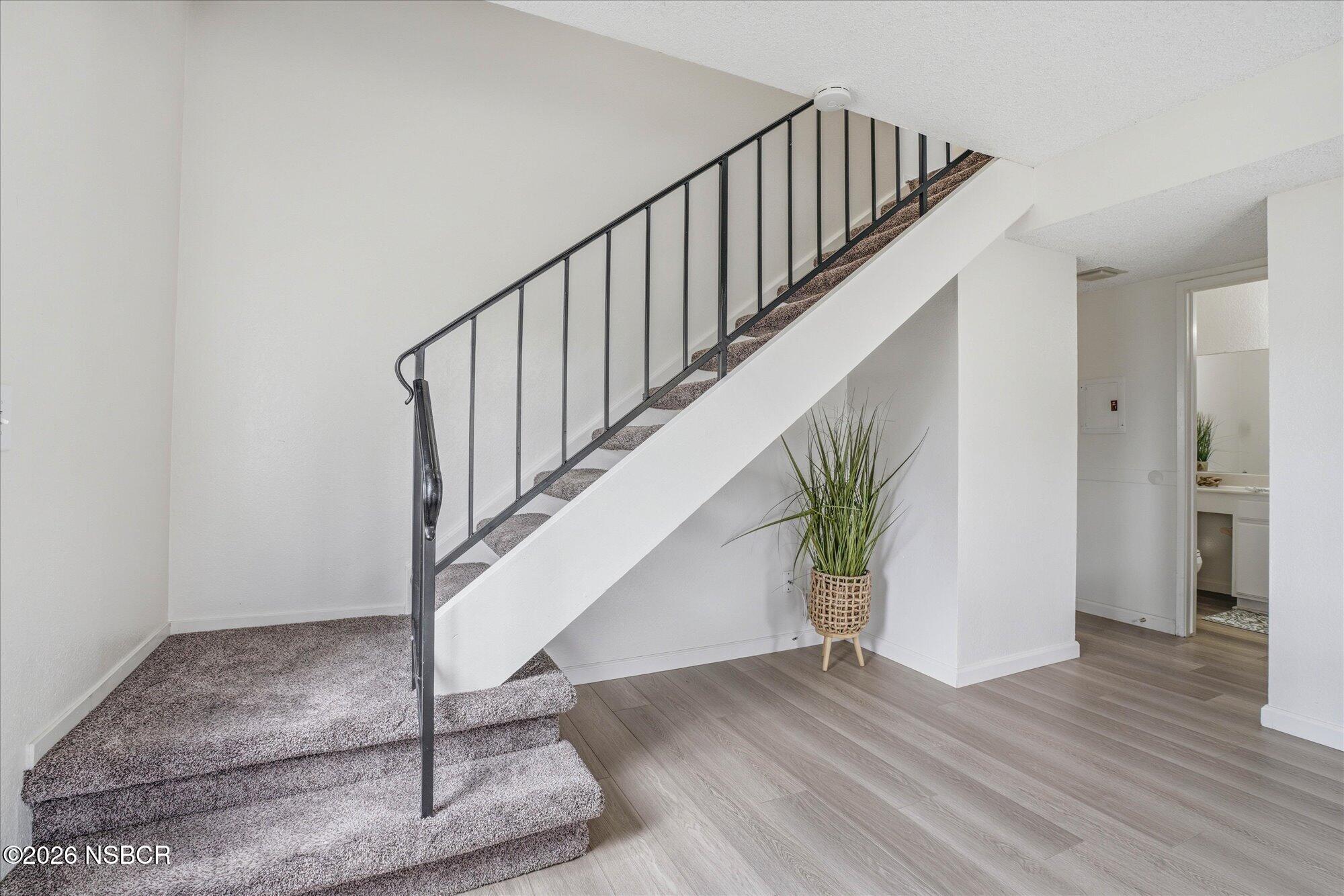 1192 Sumner Place, Unit D Santa Maria, CA 93455 - Photo 8 of 18 a view of entryway and hall with wooden floor
