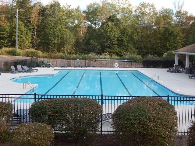 a view of yard with large trees