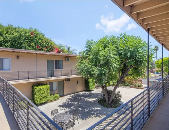 a view of a backyard with sitting area