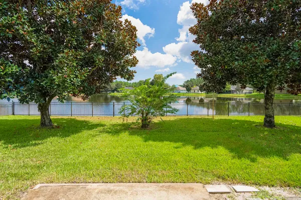 a backyard of a house with lots of green space