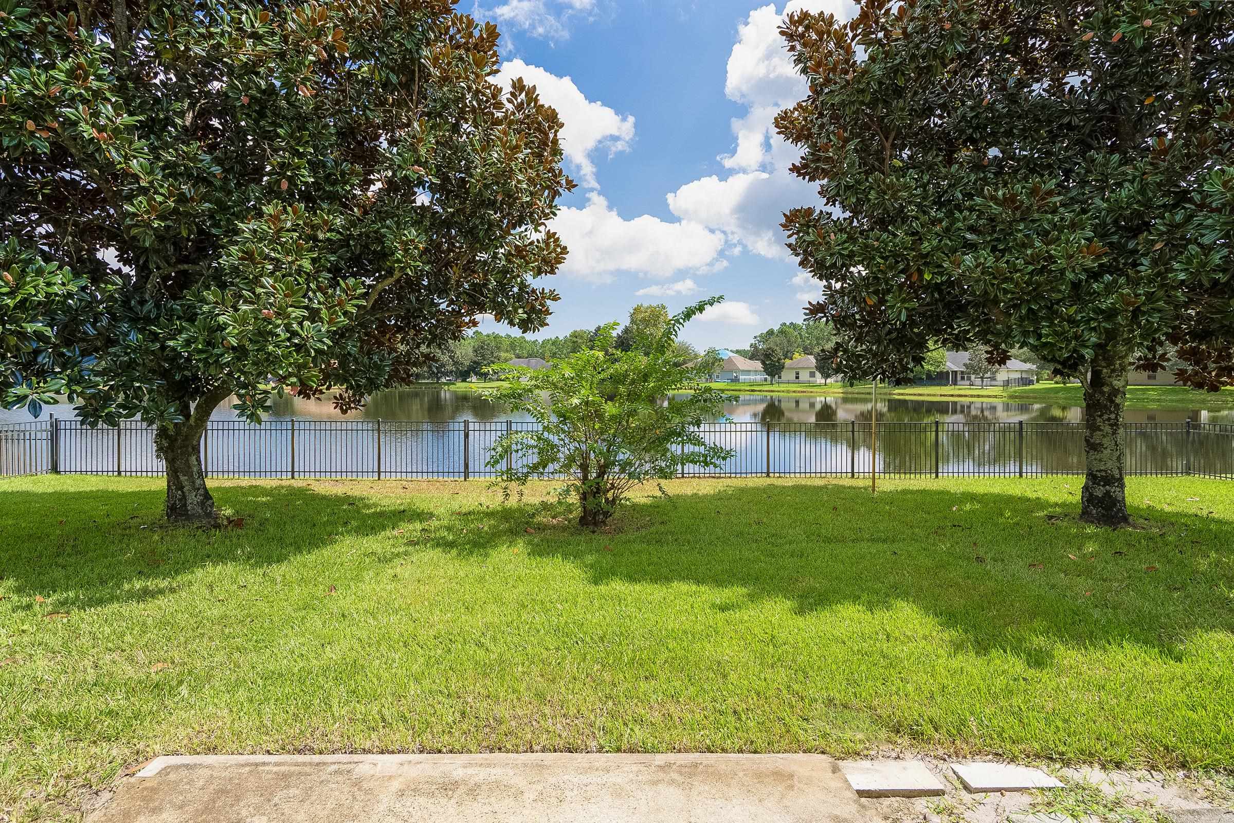 1732 South Summer Ridge Court St. Augustine, FL 32092 - Photo 11 of 42 a backyard of a house with lots of green space