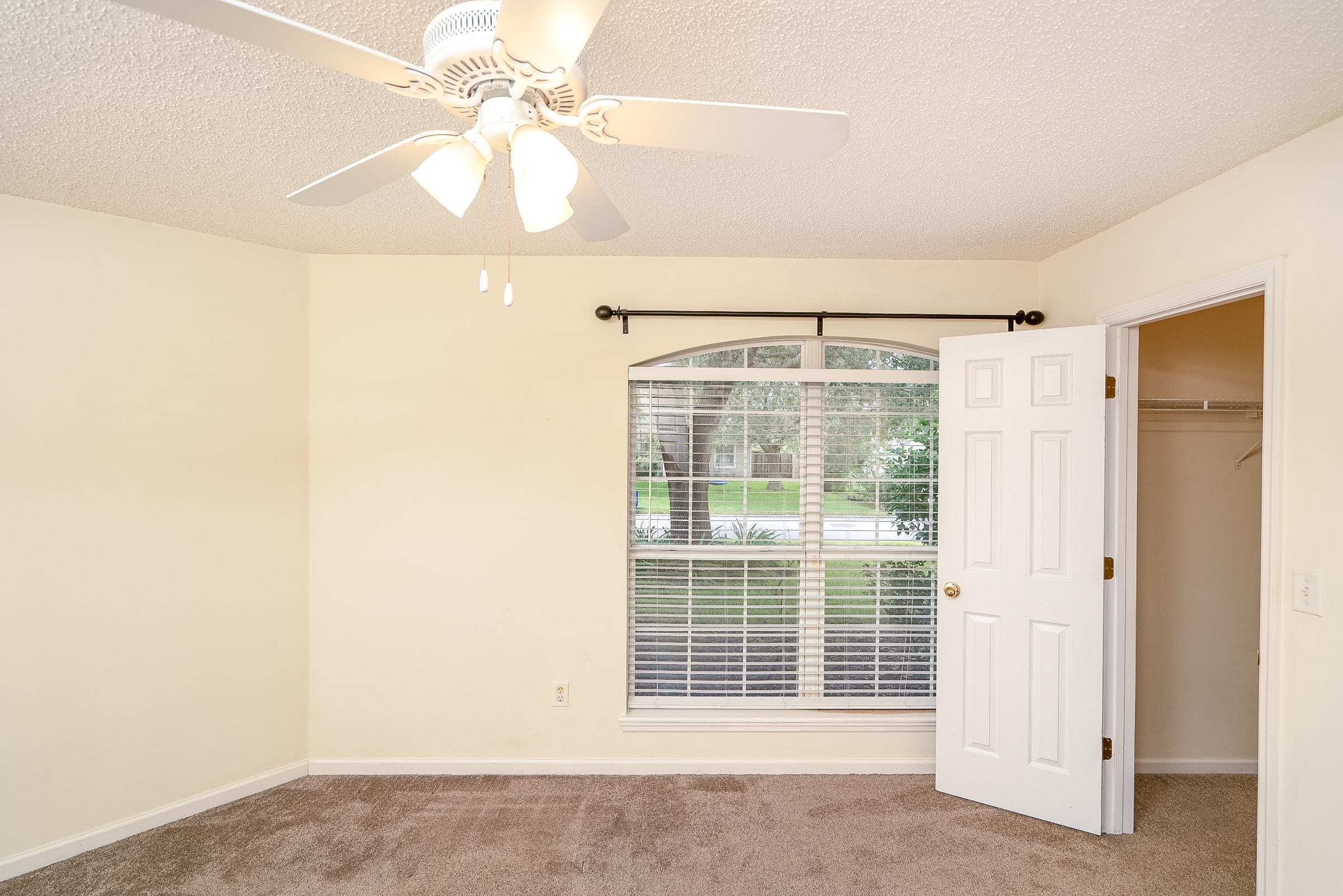 1732 South Summer Ridge Court St. Augustine, FL 32092 - Photo 29 of 42 a view of a room with a ceiling fan and a window