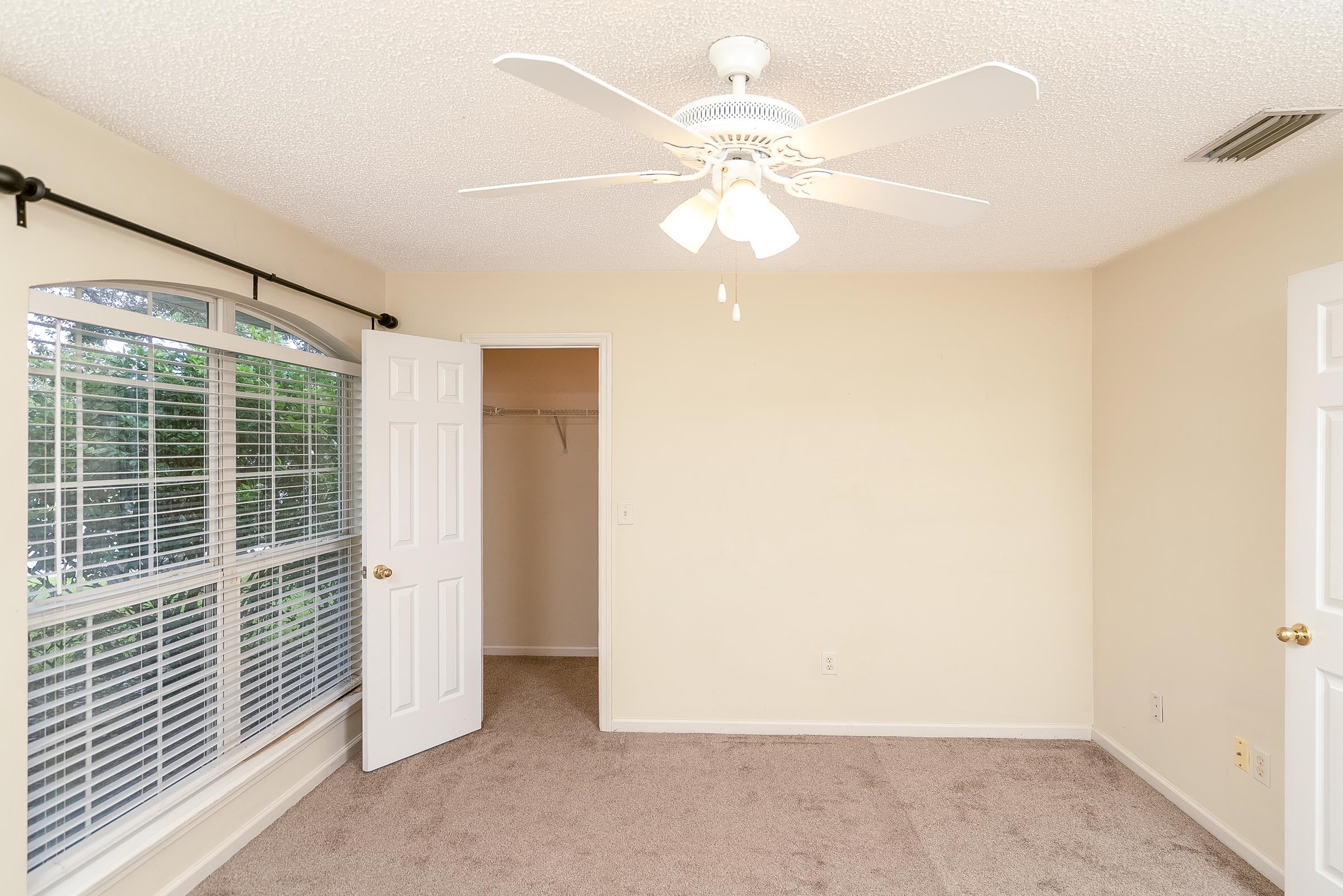 1732 South Summer Ridge Court St. Augustine, FL 32092 - Photo 30 of 42 an empty room with windows and fan