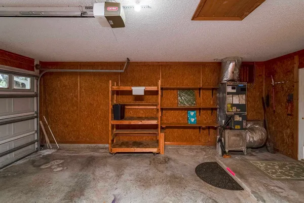 a kitchen with stainless steel appliances kitchen island granite countertop a refrigerator and a stove