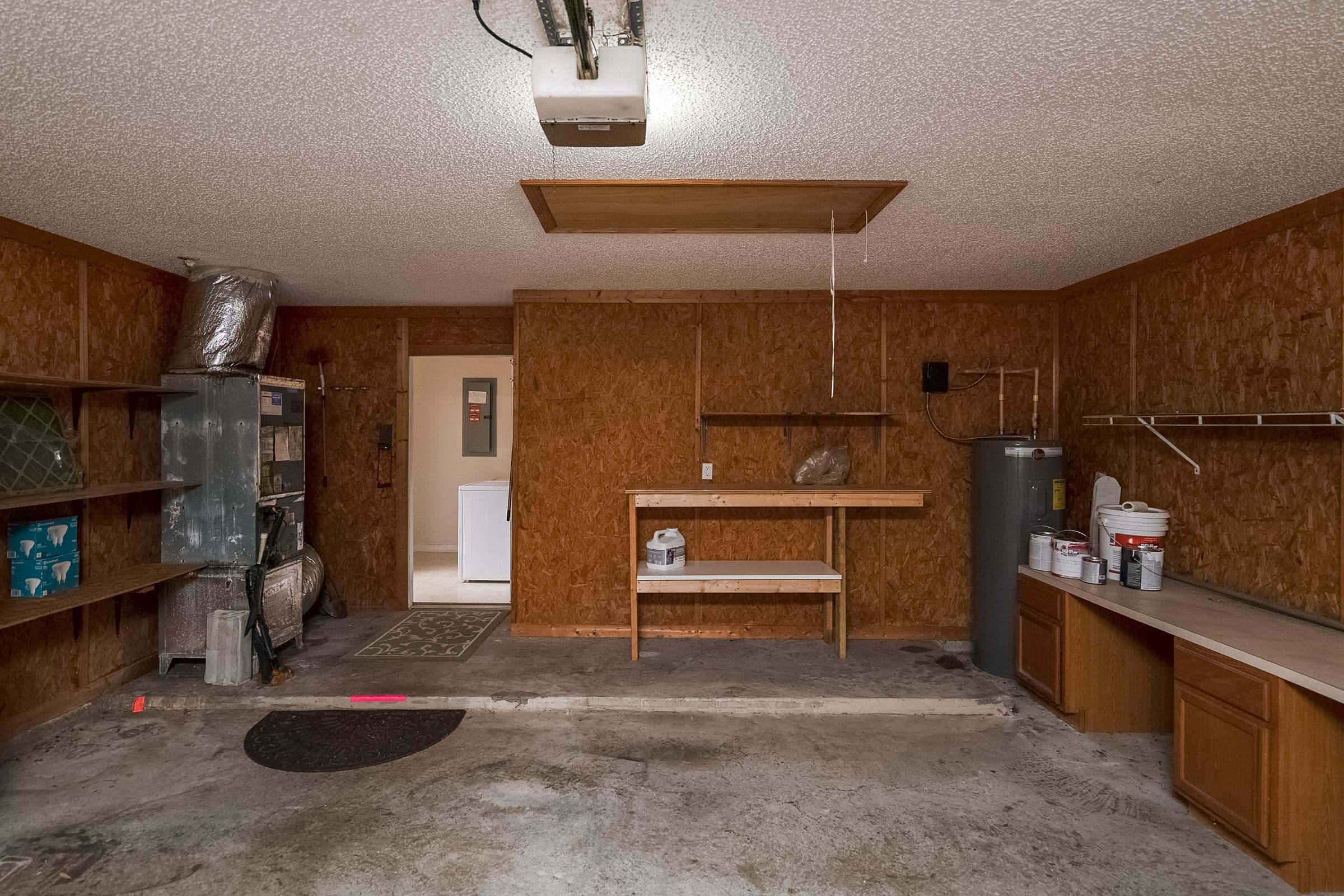 1732 South Summer Ridge Court St. Augustine, FL 32092 - Photo 38 of 42 a kitchen with stainless steel appliances kitchen island granite countertop a refrigerator and a stove