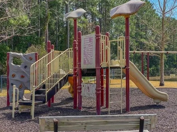 a swimming pool with outdoor seating and lake