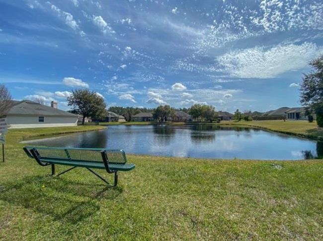 1732 South Summer Ridge Court St. Augustine, FL 32092 - Photo 42 of 42 a swimming pool with outdoor seating and lake