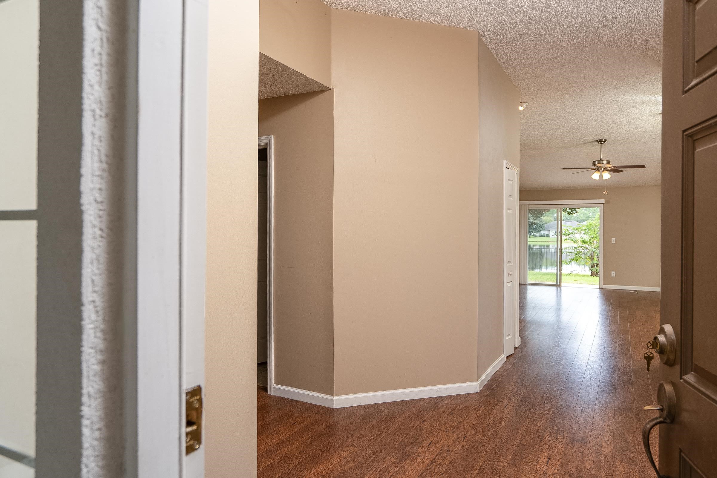 1732 South Summer Ridge Court St. Augustine, FL 32092 - Photo 5 of 42 a view of hallway with wooden floor