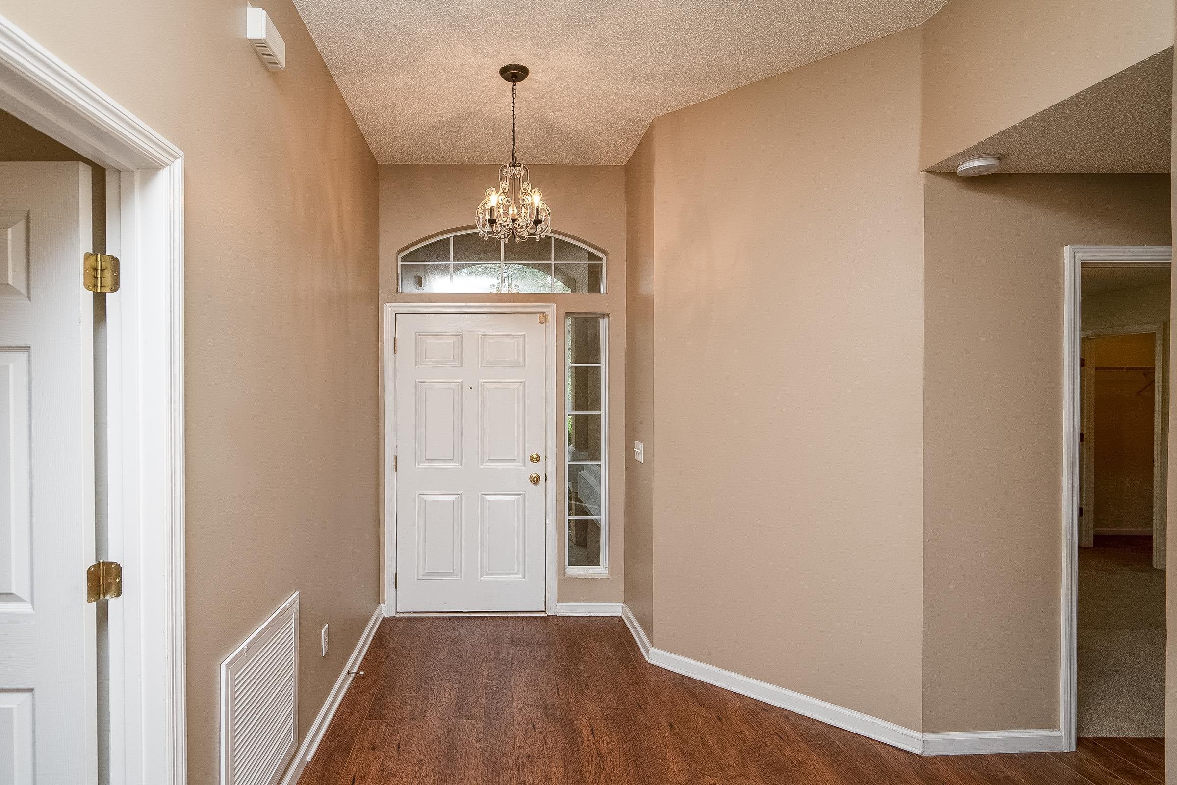 1732 South Summer Ridge Court St. Augustine, FL 32092 - Photo 6 of 42 a view of hallway with chandelier and entryway