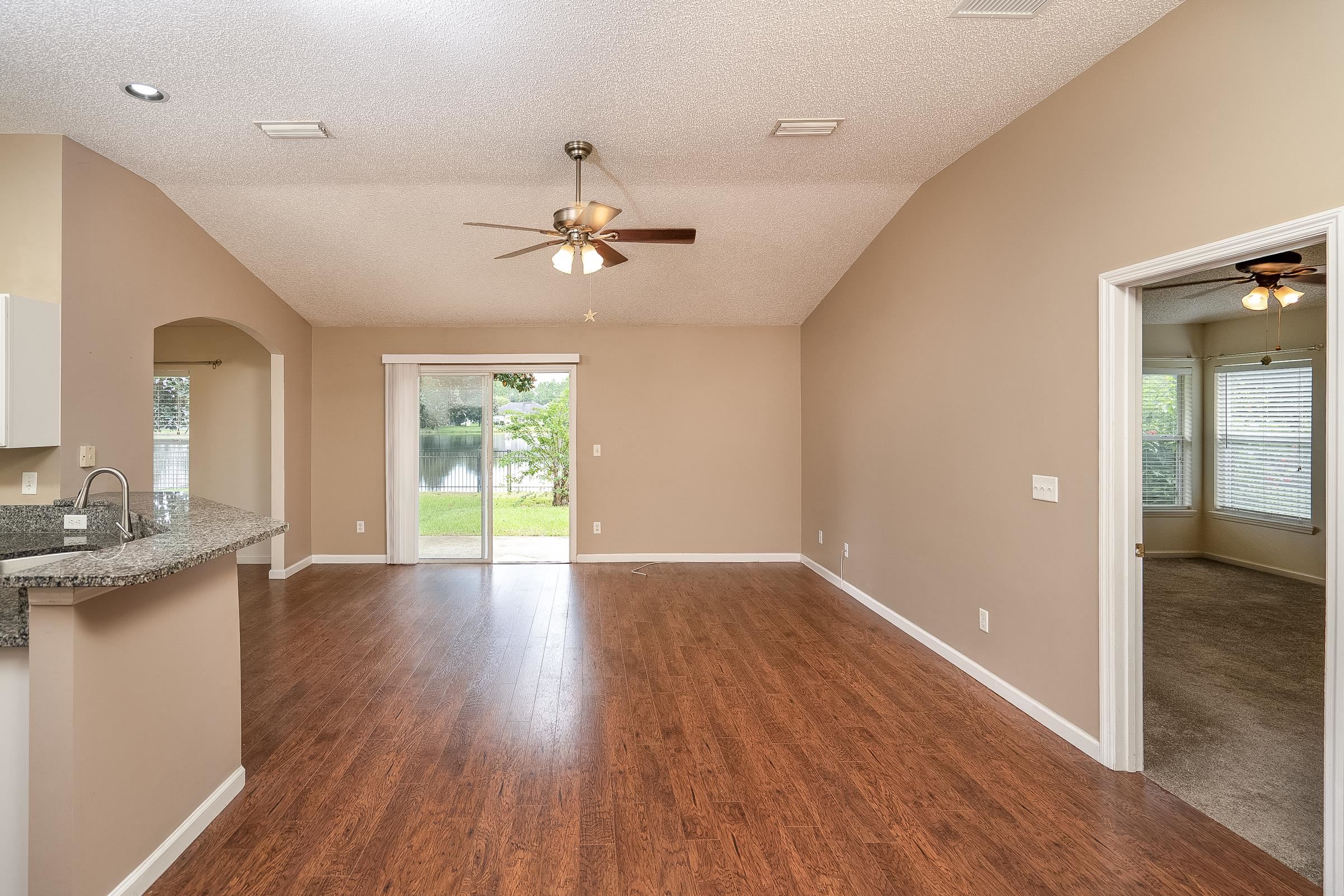 1732 South Summer Ridge Court St. Augustine, FL 32092 - Photo 7 of 42 wooden floor in an empty room with a window