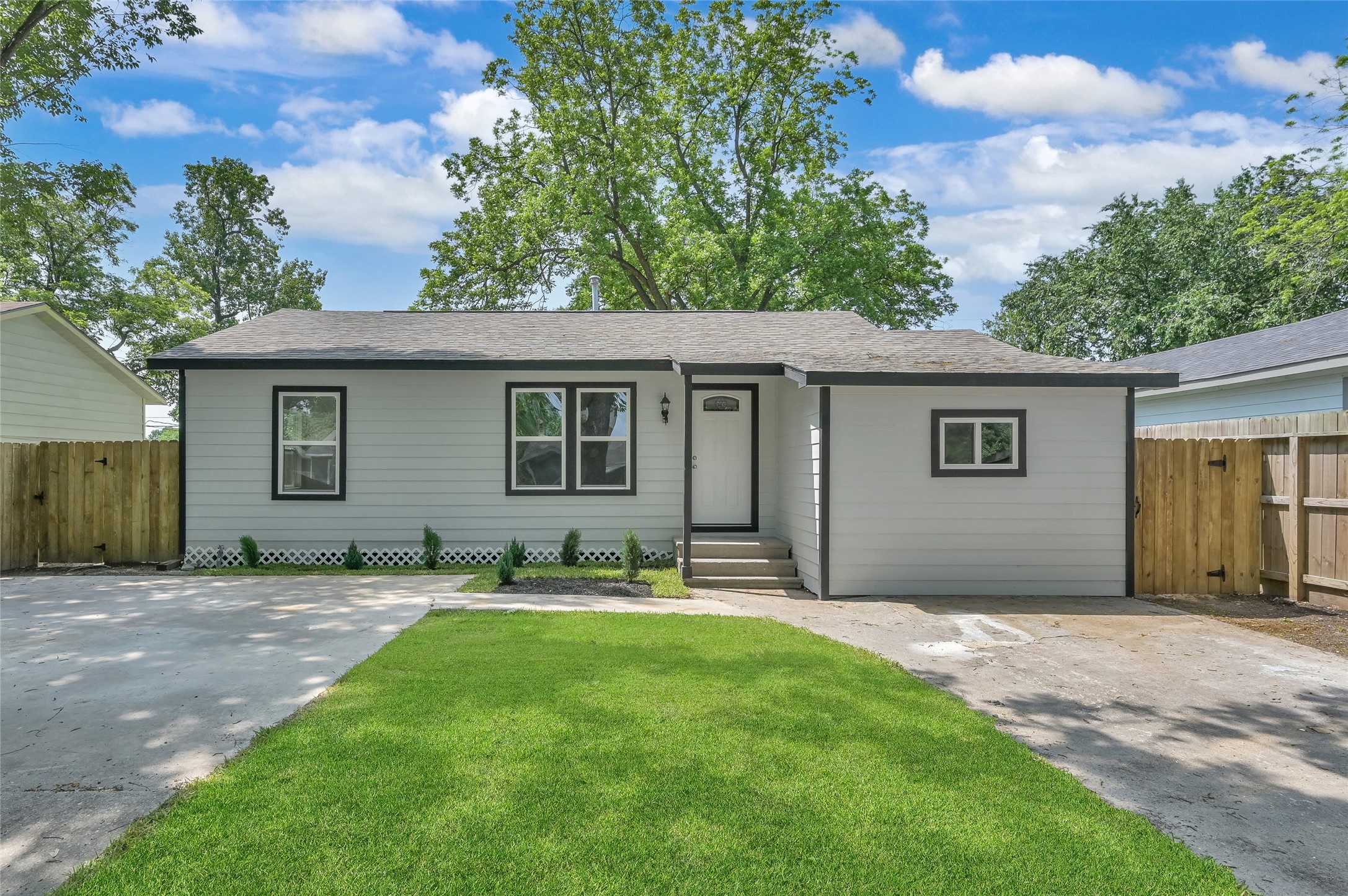a backyard of a house with yard and barbeque oven