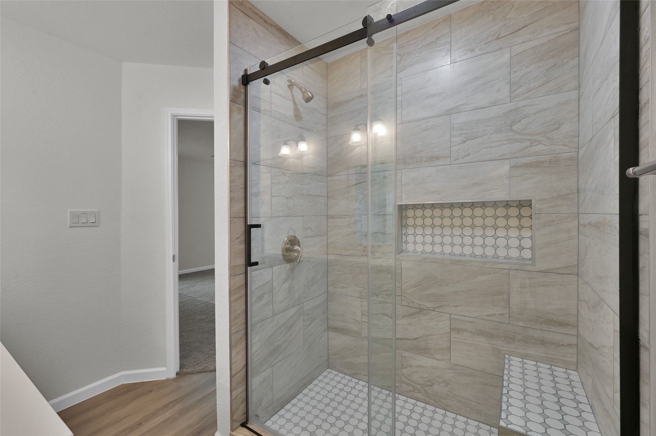 2826 Hopper Road Houston, TX 77093 - Photo 15 of 24 a bathroom with a glass door shower