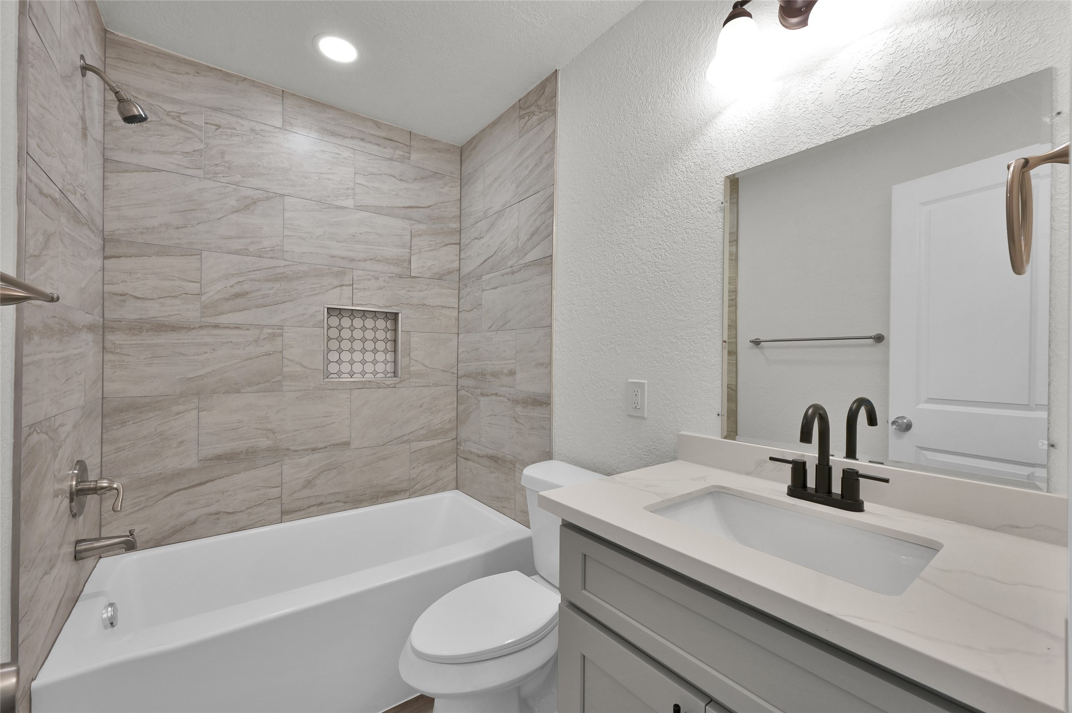 2826 Hopper Road Houston, TX 77093 - Photo 18 of 24 a bathroom with a sink a toilet and a bathtub