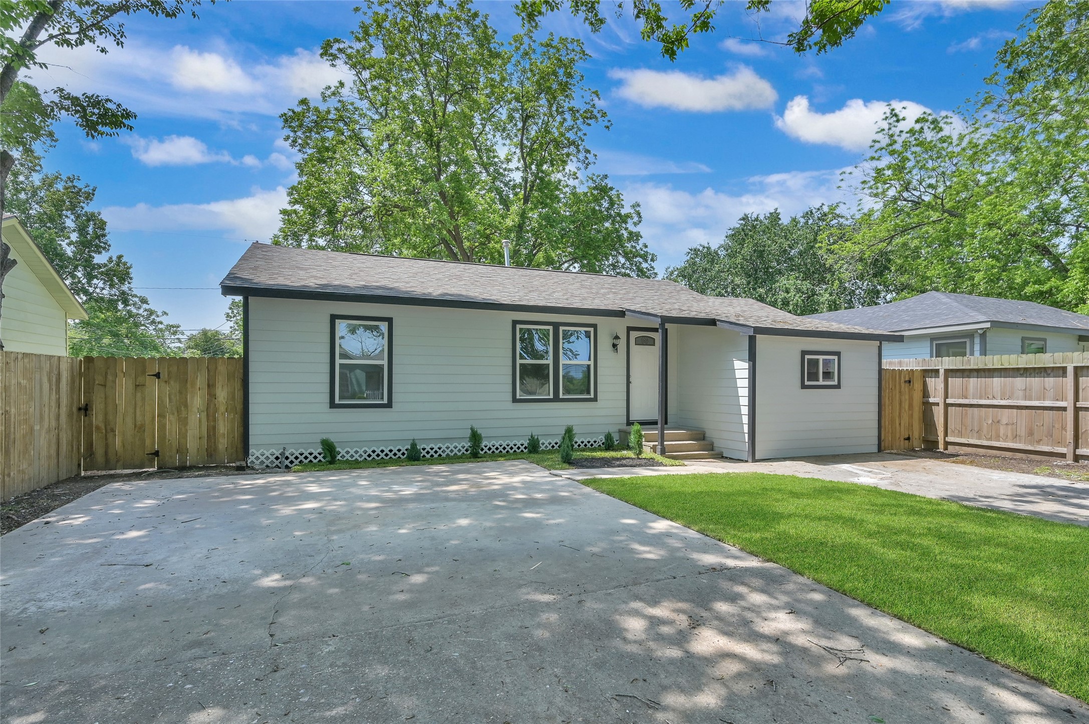 2826 Hopper Road Houston, TX 77093 - Photo 2 of 24 front view of a house with a yard