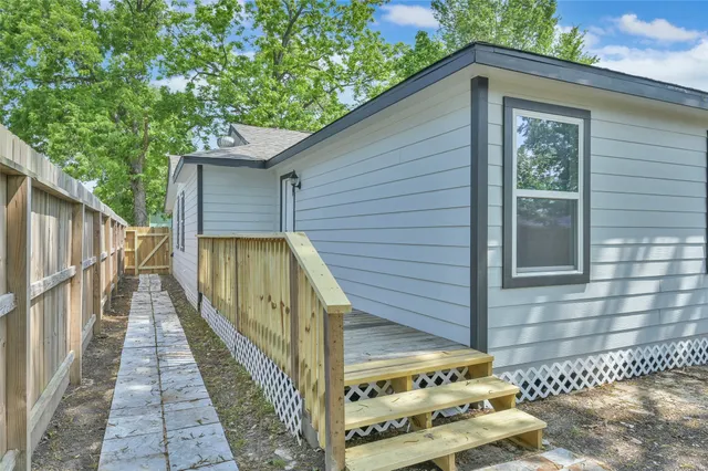 a view of a backyard with a trees