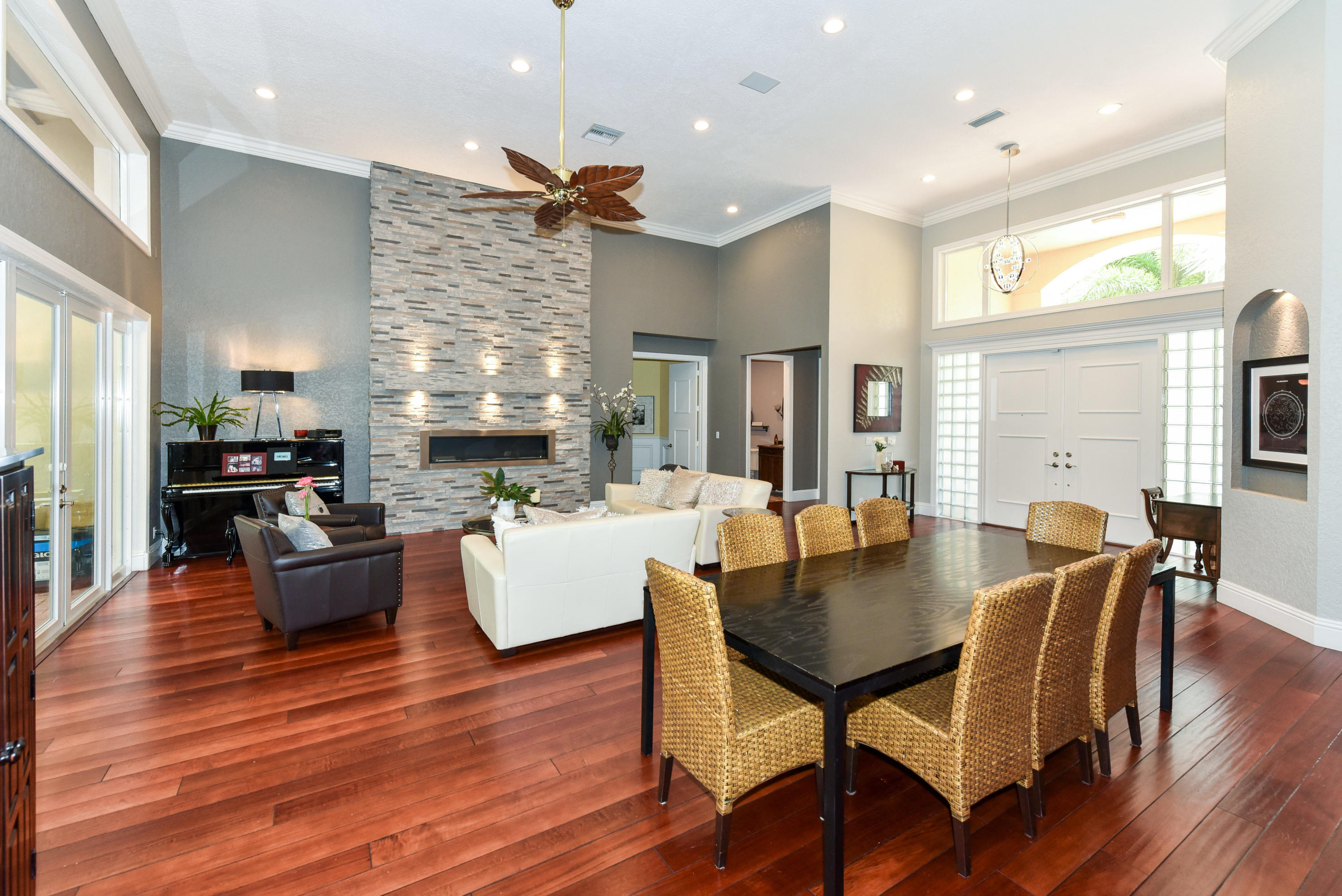 5855 Paddington Way Boca Raton, FL 33496 - Photo 8 of 40 a living room with fireplace furniture wooden floor and a kitchen view