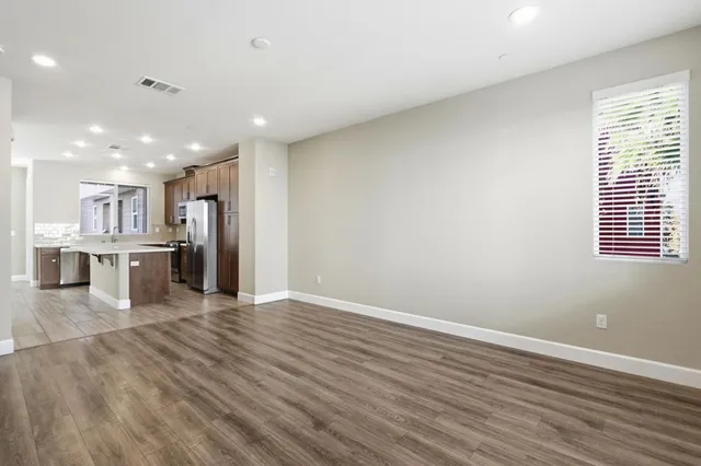 a kitchen with stainless steel appliances a stove sink microwave and cabinets