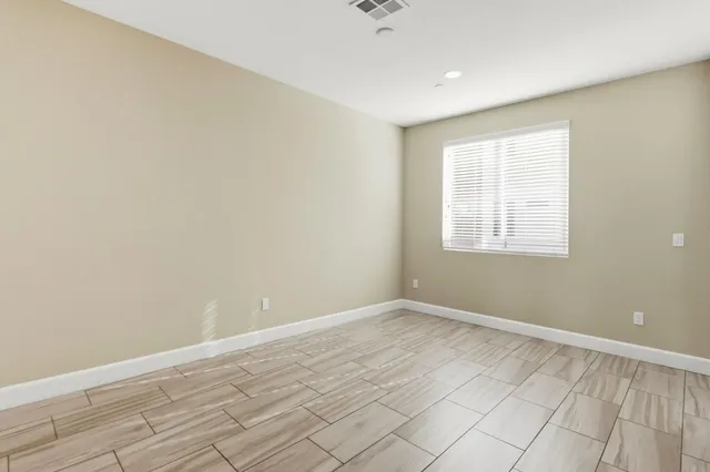 an empty room with closet area