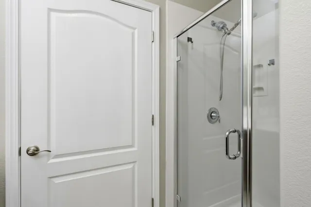 a view of a storage and utility room with a washer dryer