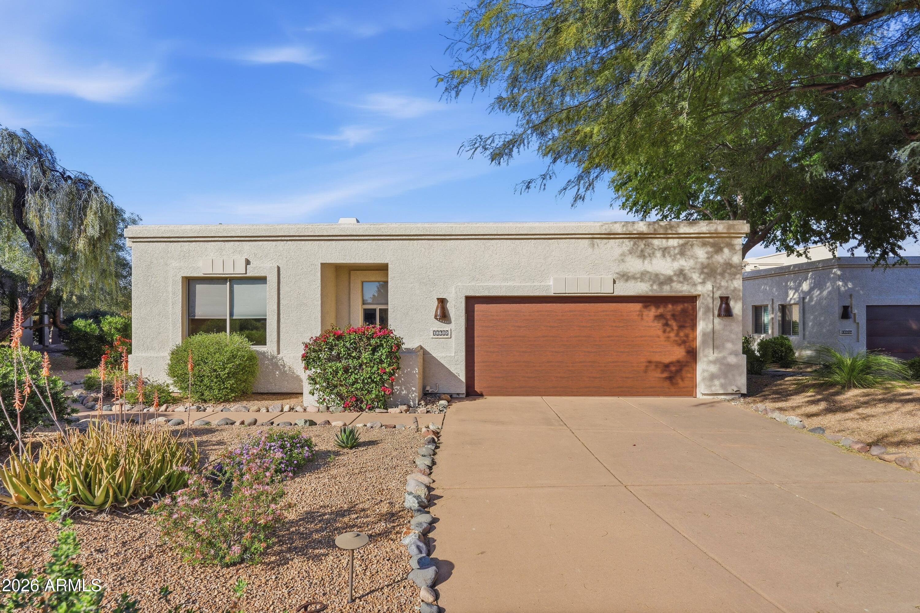 18602 Amarado Circle Rio Verde, AZ 85263 - Photo 39 of 58 a front view of a house with a yard
