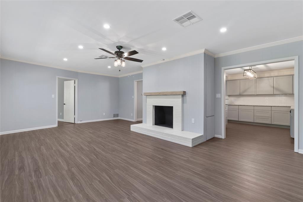 3557 Winston Road Fort Worth, TX 76109 - Photo 11 of 25 a view of an empty room with a fireplace and a window
