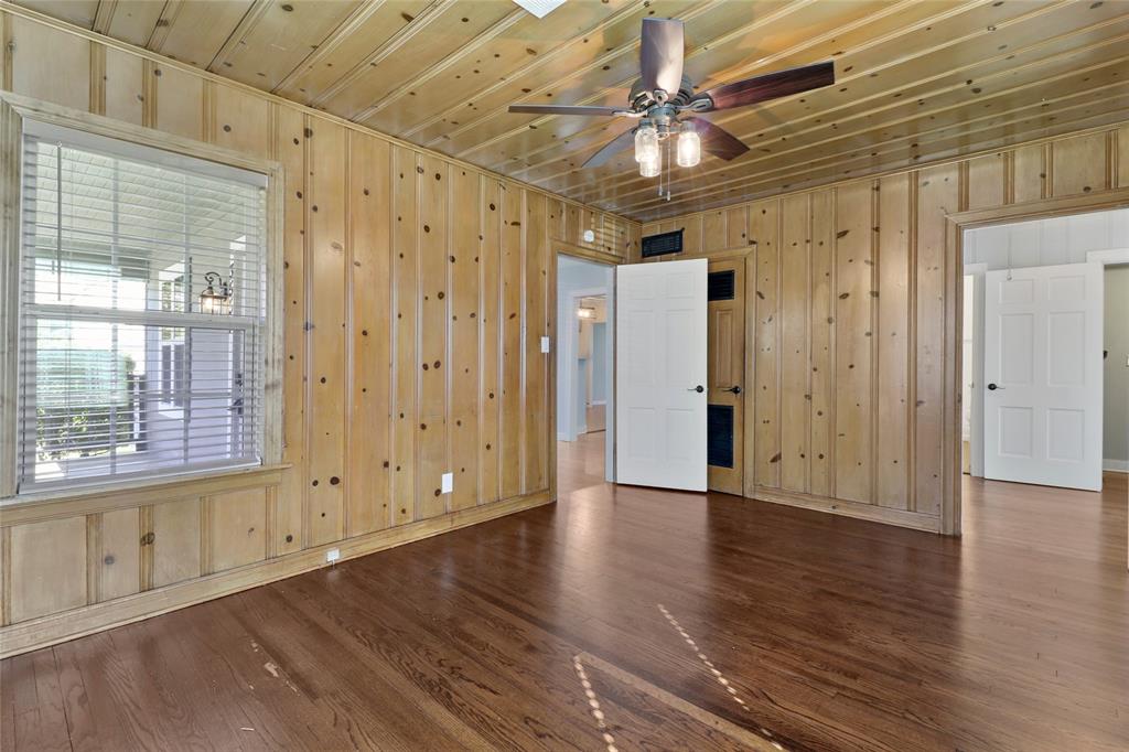 3557 Winston Road Fort Worth, TX 76109 - Photo 13 of 25 a view of an empty room with wooden floor and a window