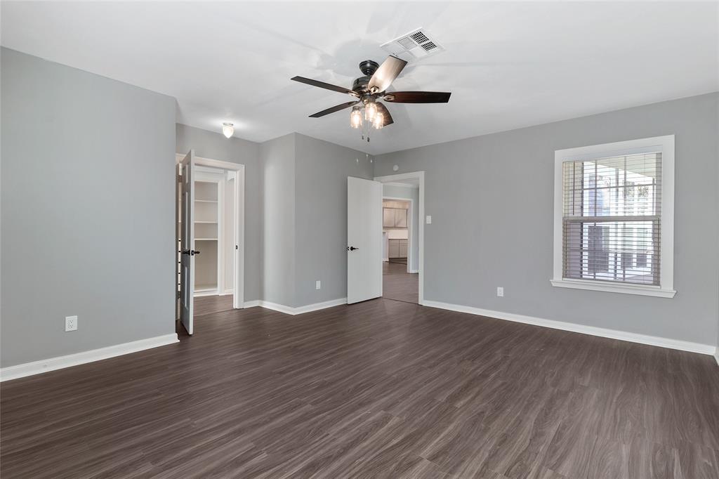 3557 Winston Road Fort Worth, TX 76109 - Photo 15 of 25 a view of an empty room with wooden floor and a window