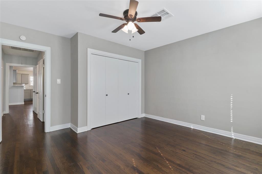 3557 Winston Road Fort Worth, TX 76109 - Photo 20 of 25 a view of a room with wooden floor and a ceiling fan
