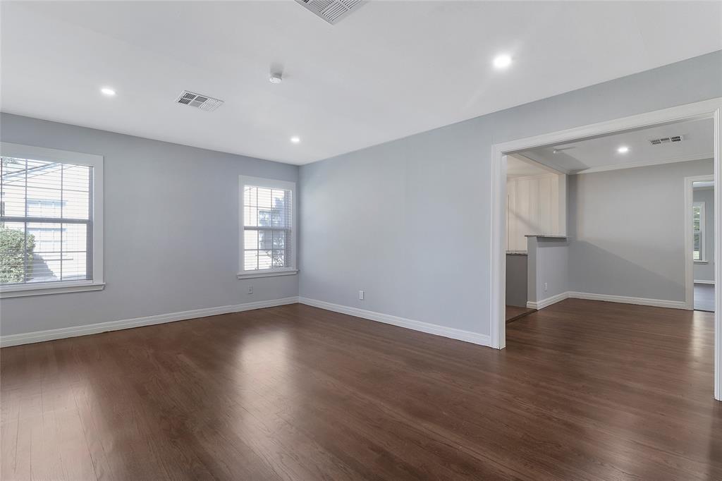 3557 Winston Road Fort Worth, TX 76109 - Photo 3 of 25 an empty room with wooden floor and windows
