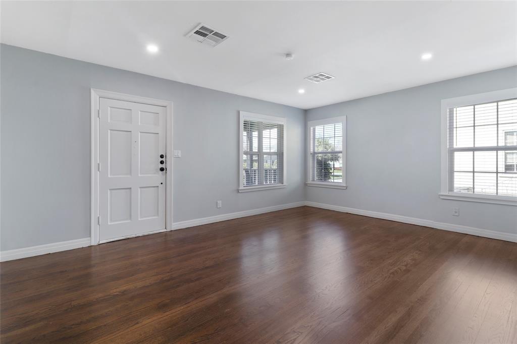 3557 Winston Road Fort Worth, TX 76109 - Photo 4 of 25 a view of an empty room with wooden floor and window